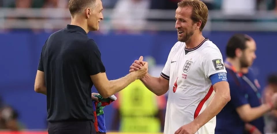 Men shaking hands after football match