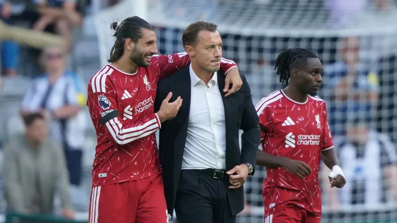Liverpool players celebrating with their manager after match
