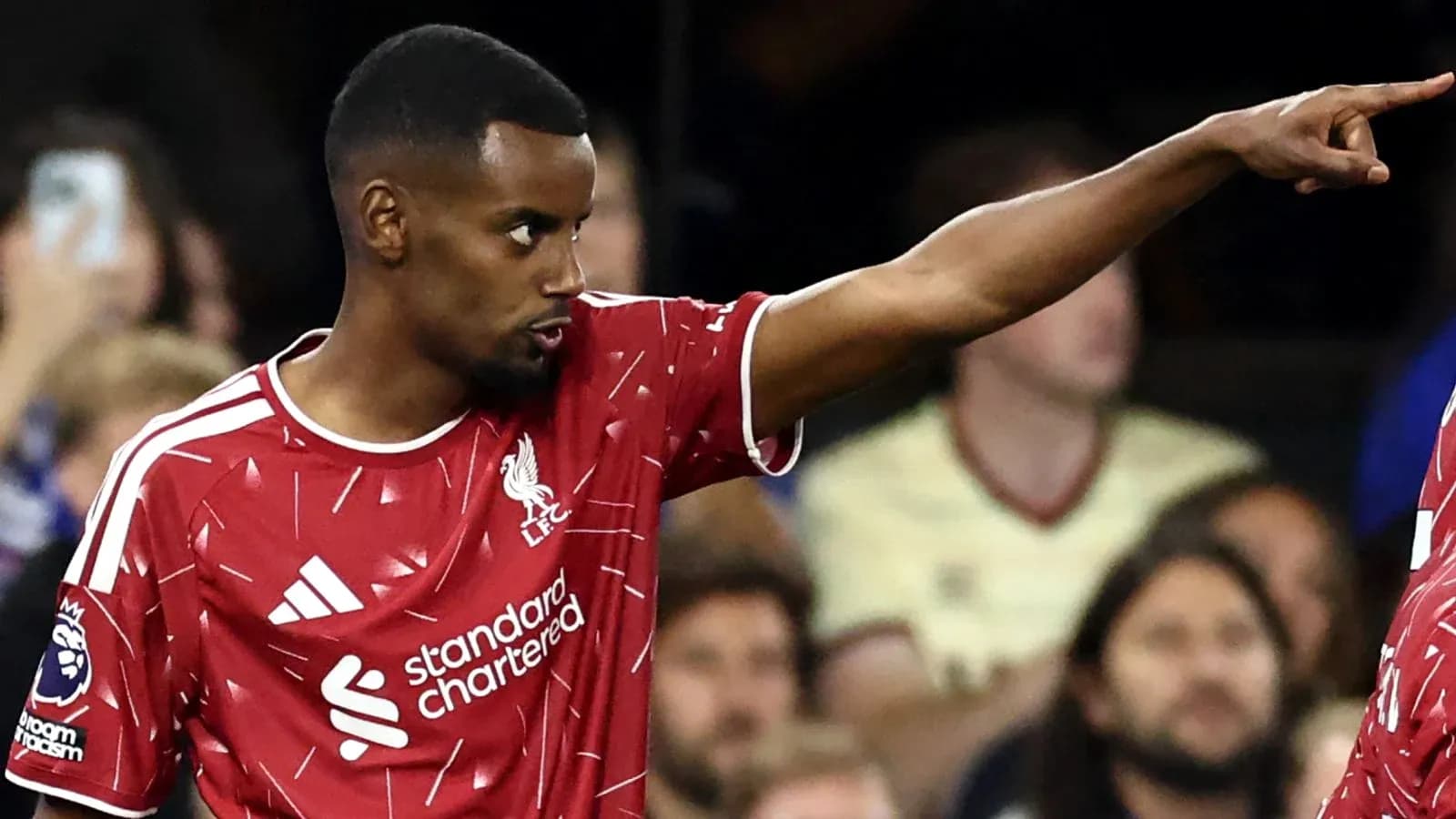 Liverpool player pointing during match action