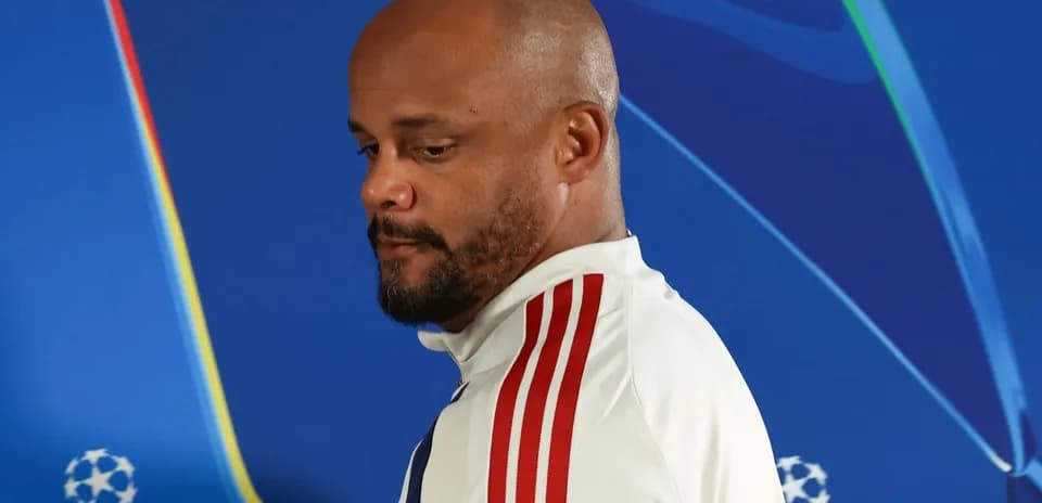 Men's football manager at press conference backdrop