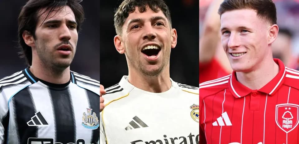 Three football players in club jerseys smiling