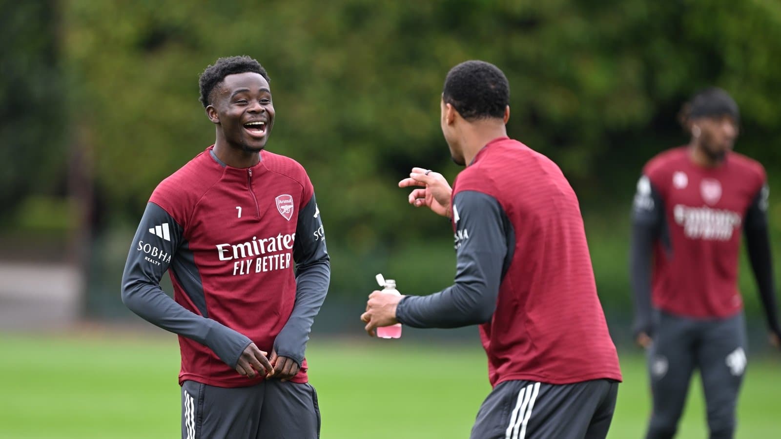 Arsenal players laughing during training session