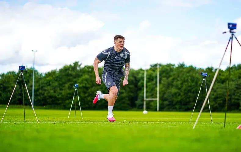 Player sprinting during training session on pitch