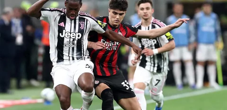Juventus and AC Milan players competing for the ball