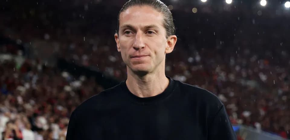 Individual in black shirt at crowded stadium
