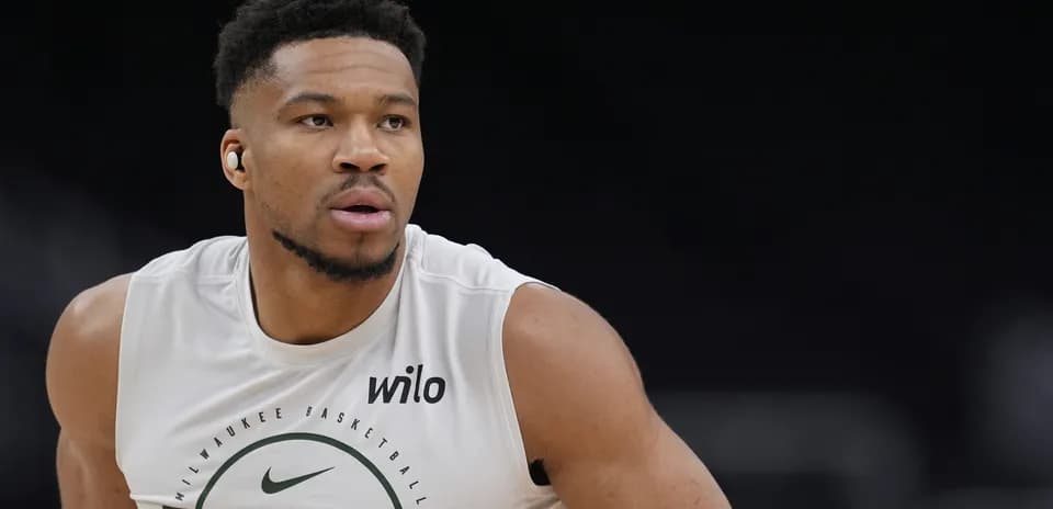 Basketball player training in Milwaukee Bucks jersey