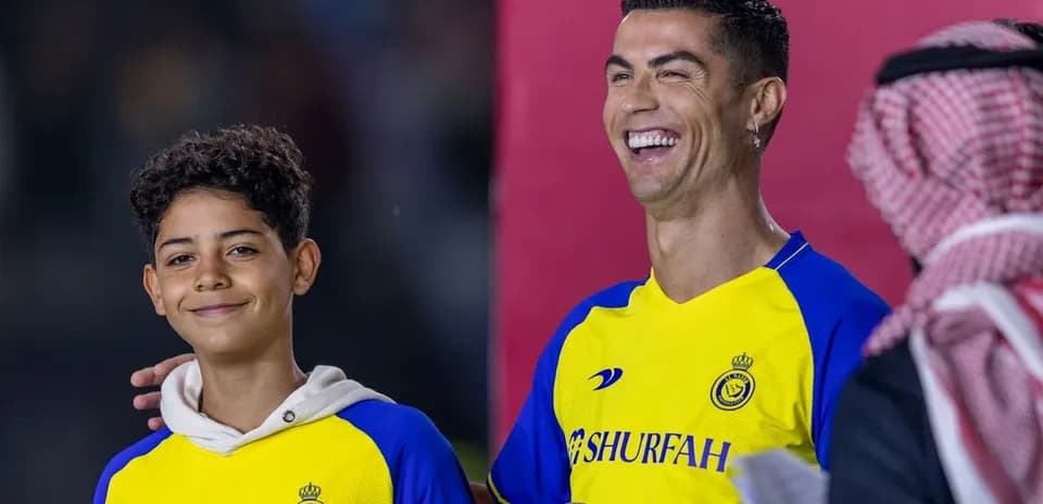 Cristiano Ronaldo smiling with a young fan