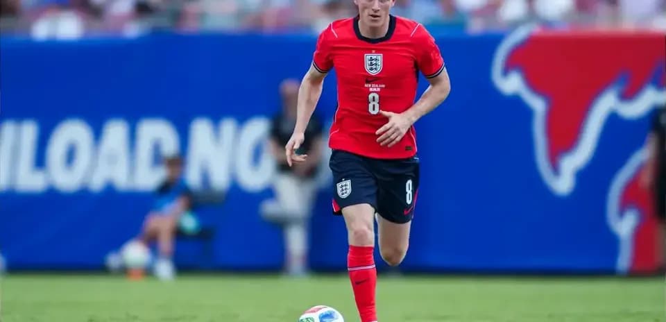 Player dribbling ball during football match