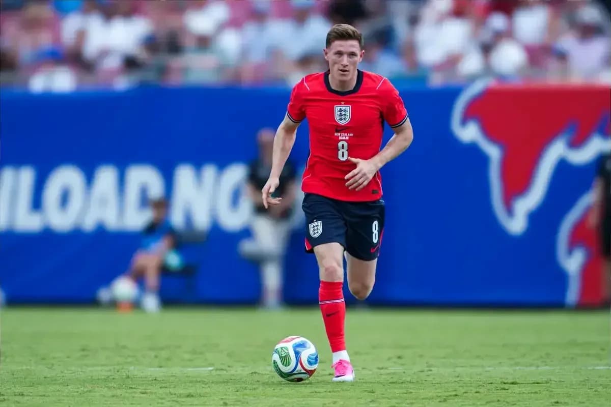 Player dribbling ball during football match