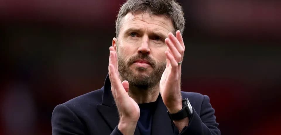 Coach applauding after a match at stadium