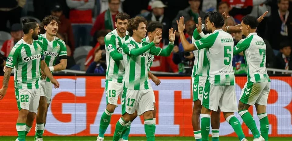 Real Betis players celebrating a goal on pitch