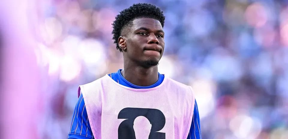 Player in warm-up jersey on the sidelines