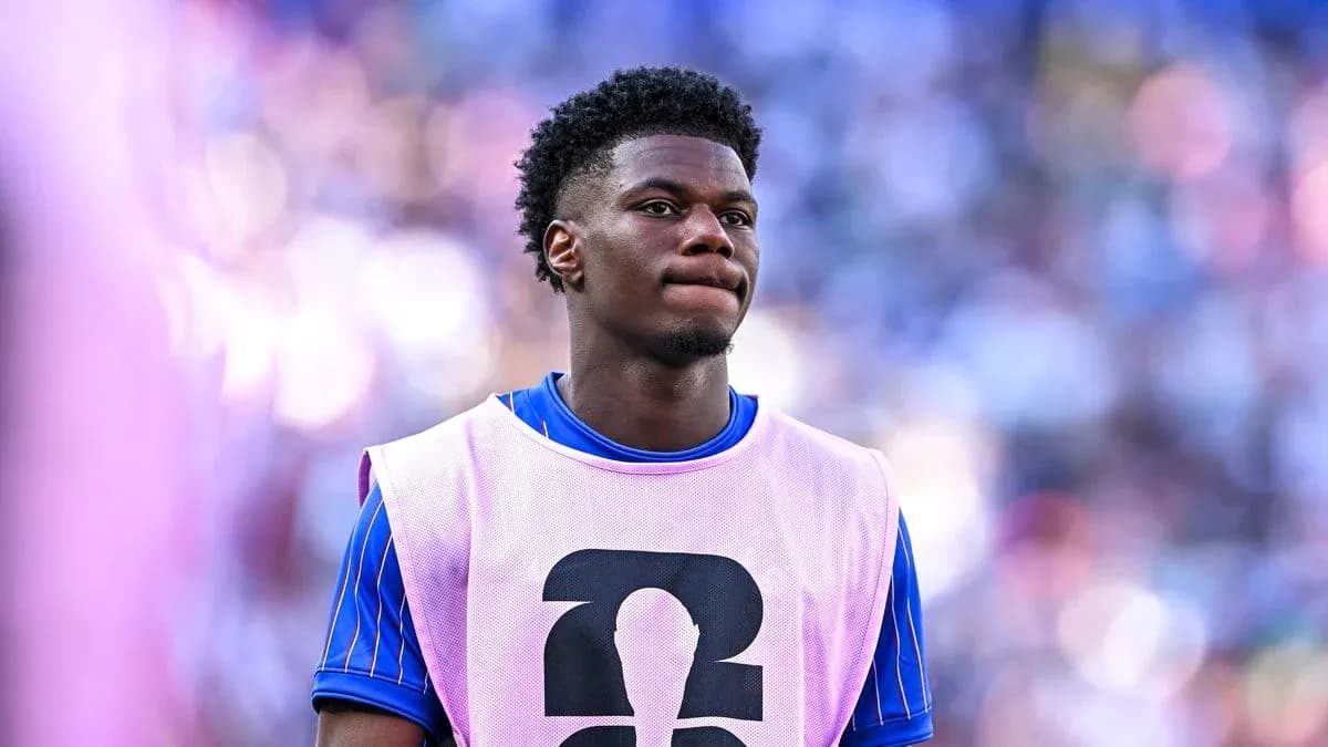 Player in warm-up jersey on the sidelines