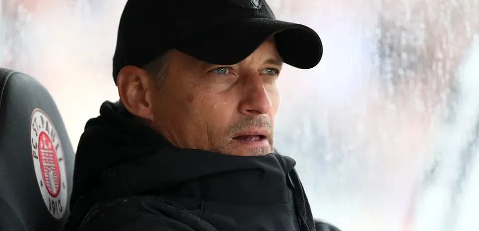 Coach observing the match from the sidelines