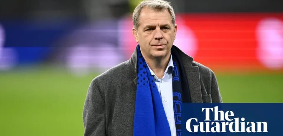 Person wearing a coat and scarf on field