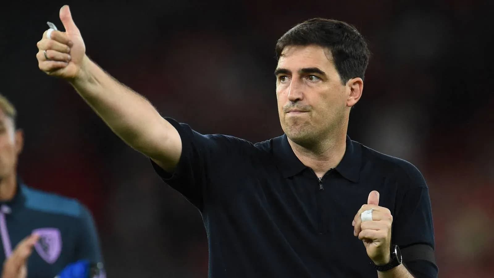 Coach giving thumbs up after match