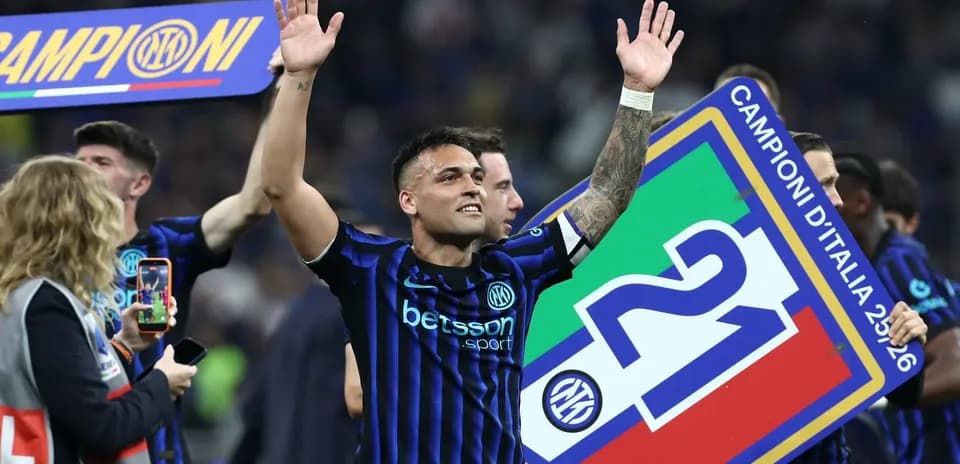 Lautaro Martínez celebrating with championship banner