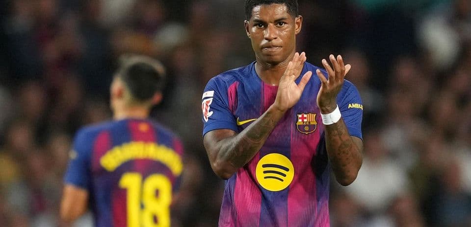 Barcelona player applauding during match