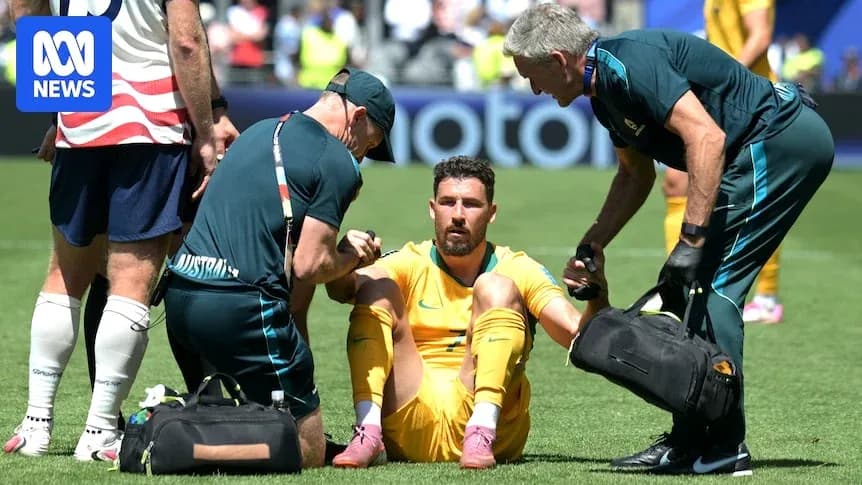 Goalkeeper receiving medical attention on the field