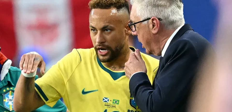 Neymar conversing with coach during a match
