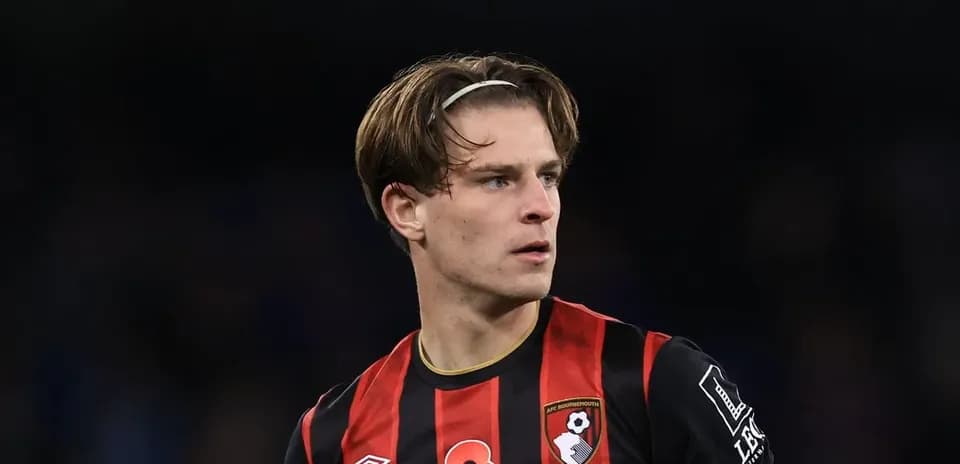 AFC Bournemouth player in black and red jersey