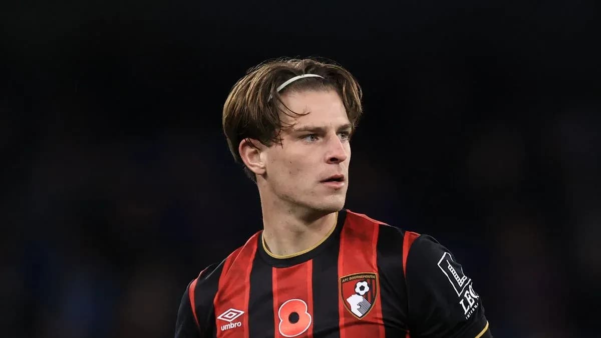 AFC Bournemouth player in black and red jersey