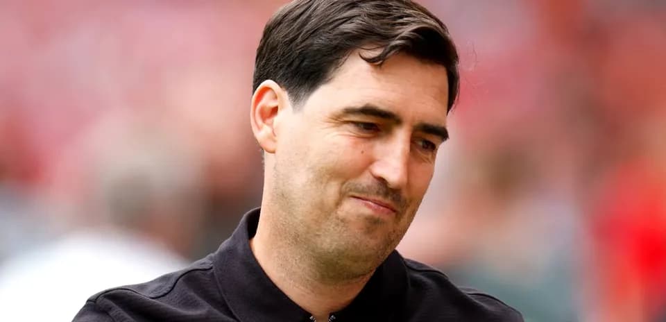 Football coach on the pitch during match