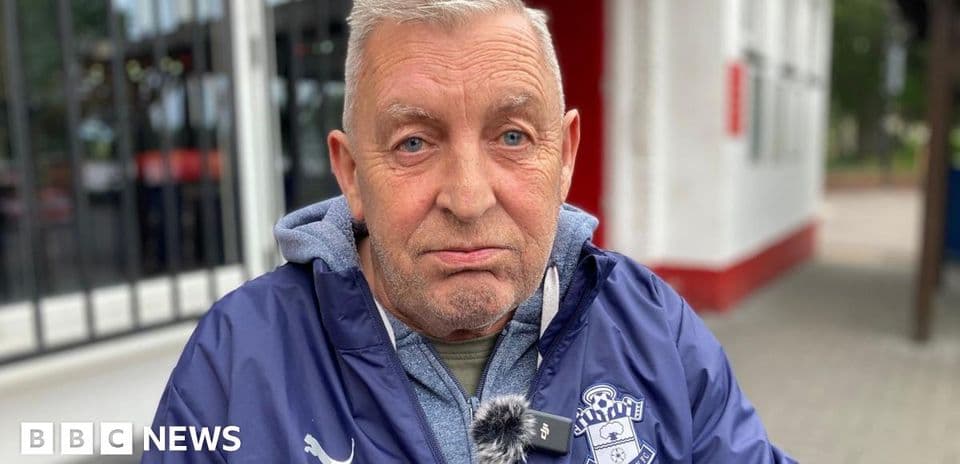 Older man wearing Southampton FC jacket outdoors