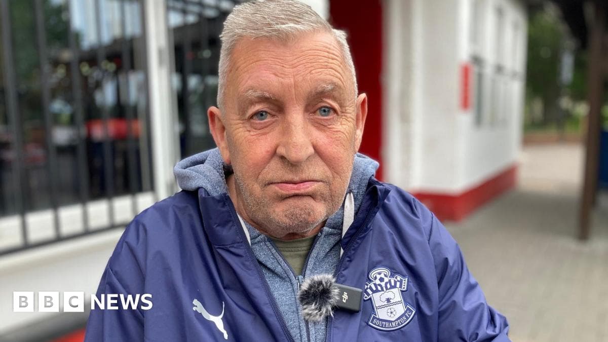 Older man wearing Southampton FC jacket outdoors