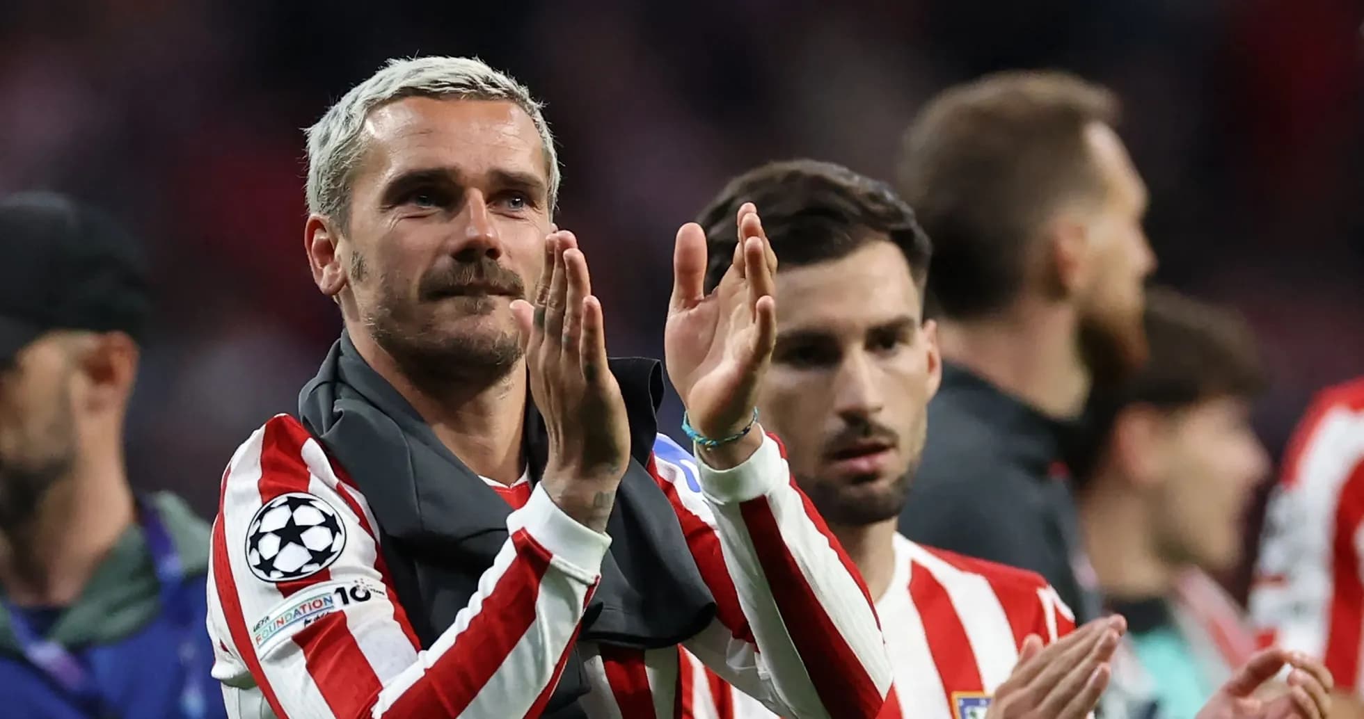 Atletico Madrid players applauding fans after match