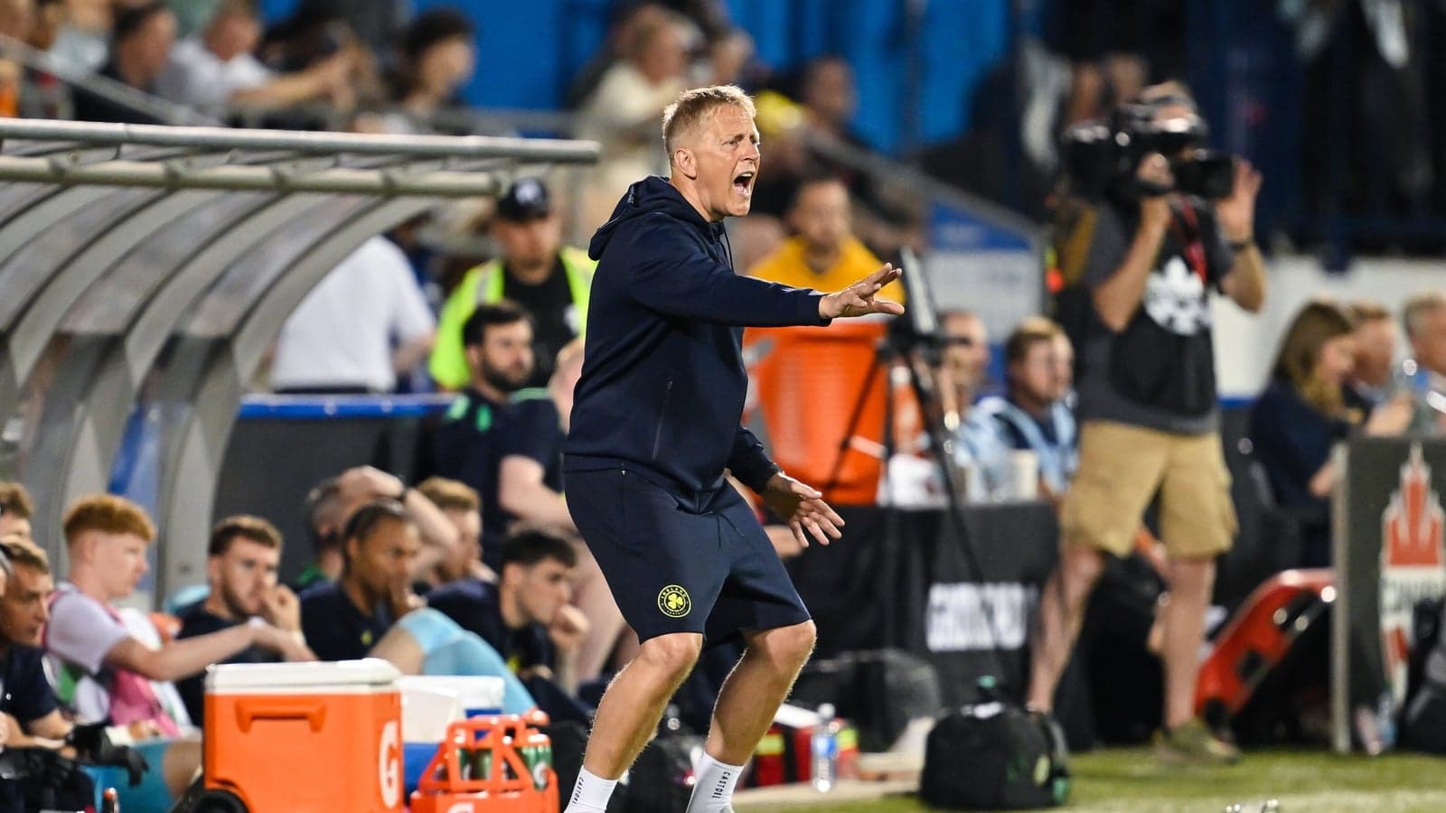 Coach giving instructions from the sidelines during match