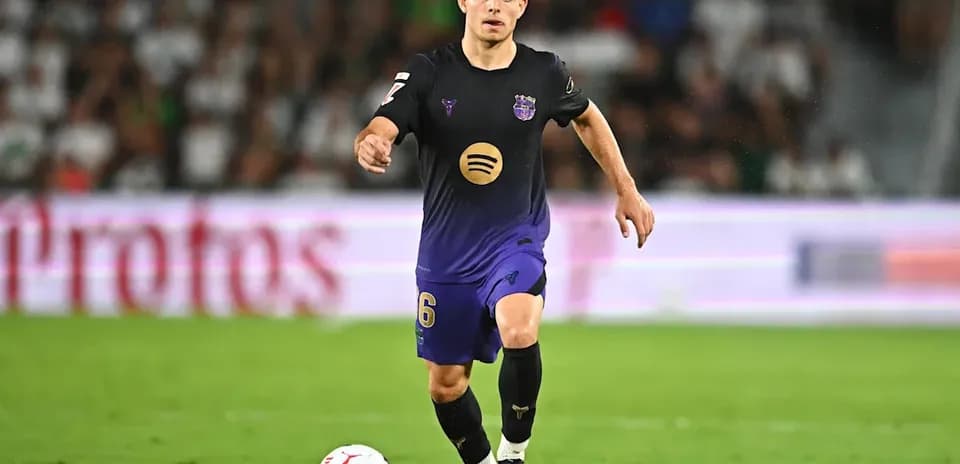 Player dribbling ball during a football match