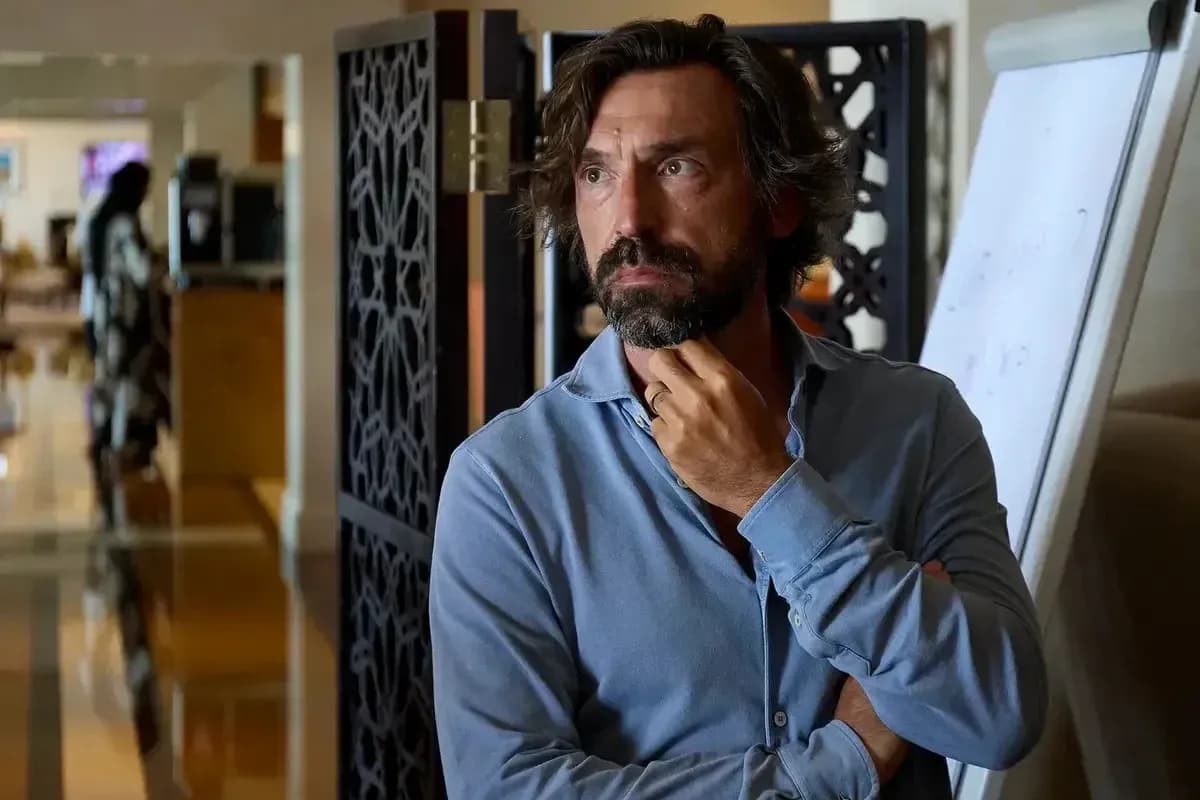 Man in a blue shirt standing in a room
