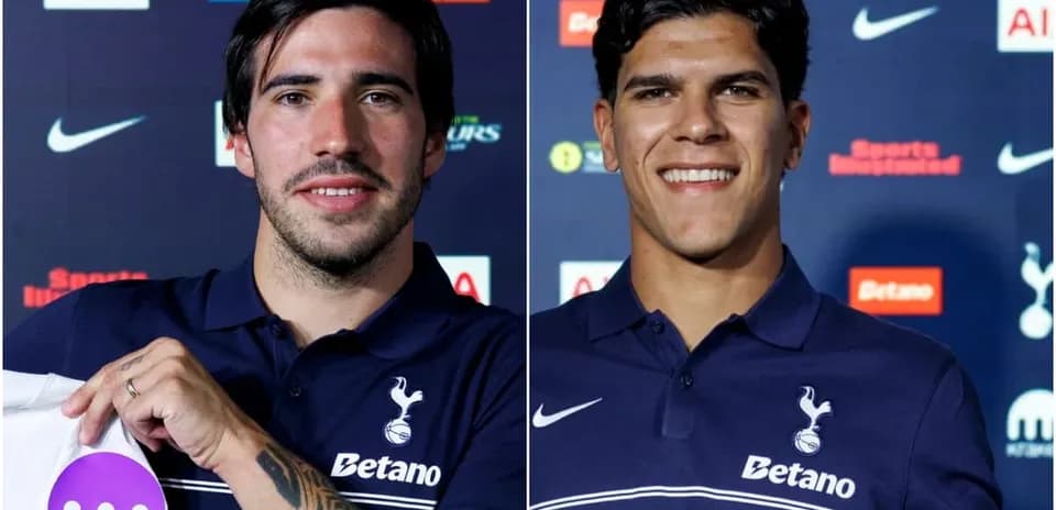 Two football players posing at press conference