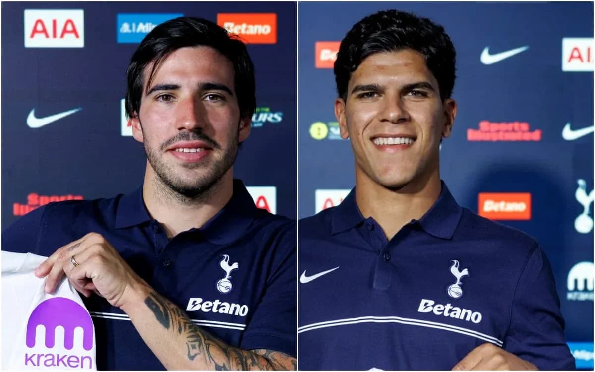 Two football players posing at press conference