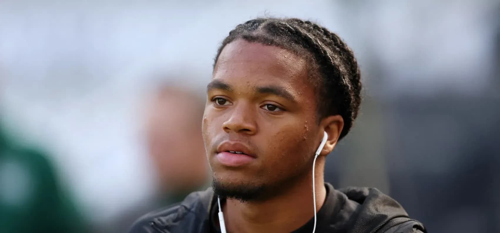 Player wearing headphones before the match