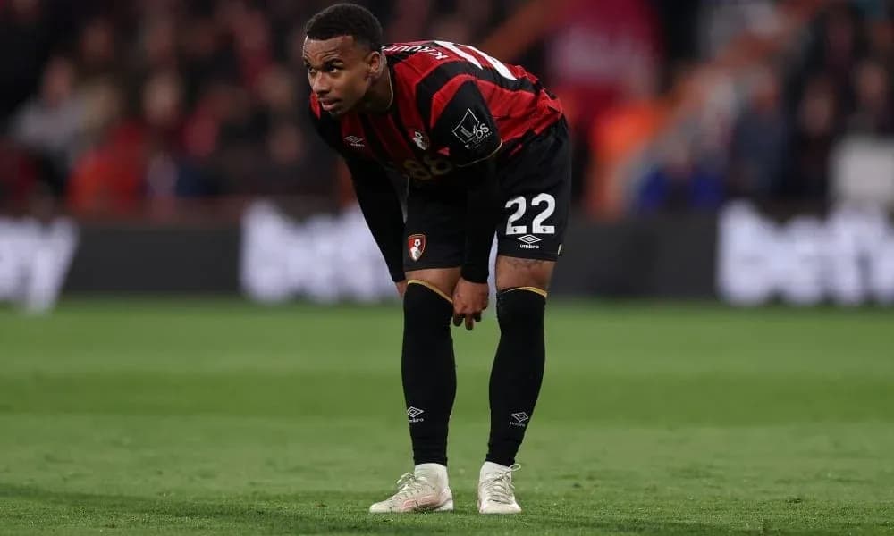 Bournemouth player bending down on the pitch