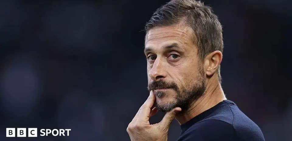 Coach looking thoughtfully during a match