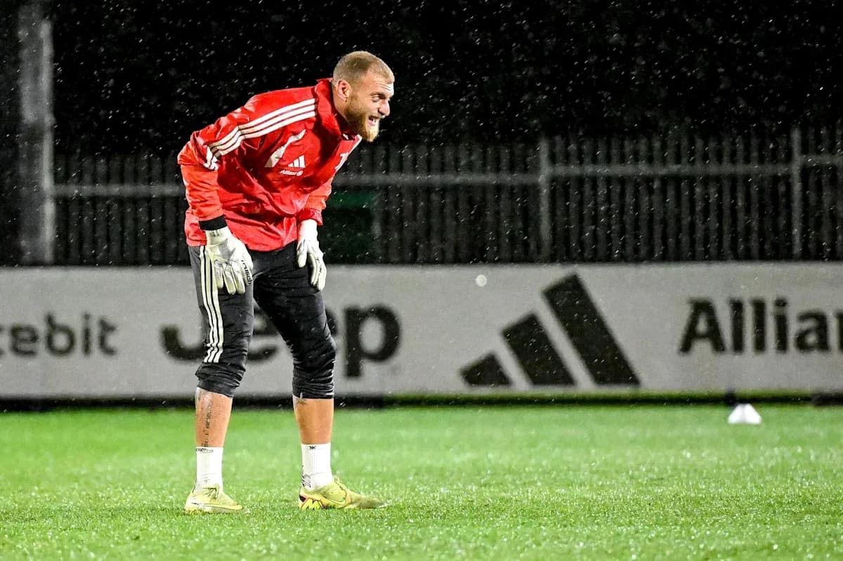 Goalkeeper training in the rain during practice session