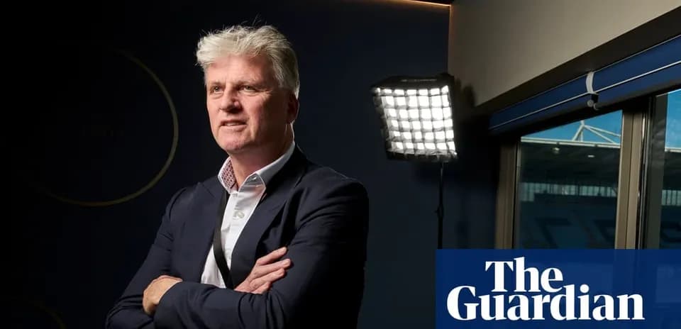Man posing in front of bright studio lighting