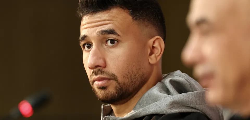 Athlete at press conference with microphone in foreground
