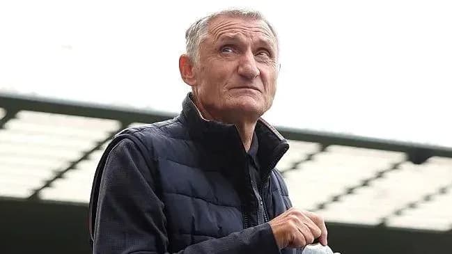 Older man looking up at stadium stands
