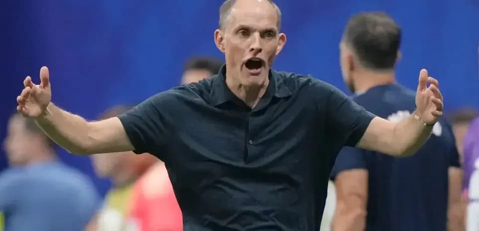 Coach gesturing passionately during a match