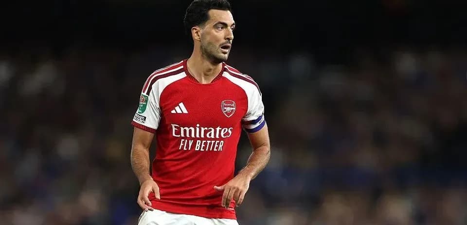Arsenal player in red jersey on the field