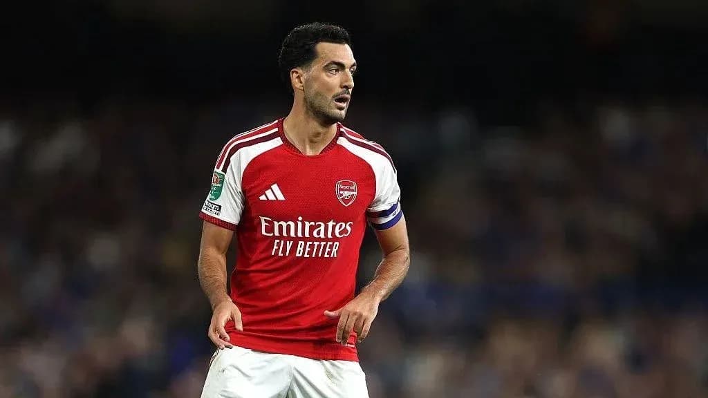 Arsenal player in red jersey on the field