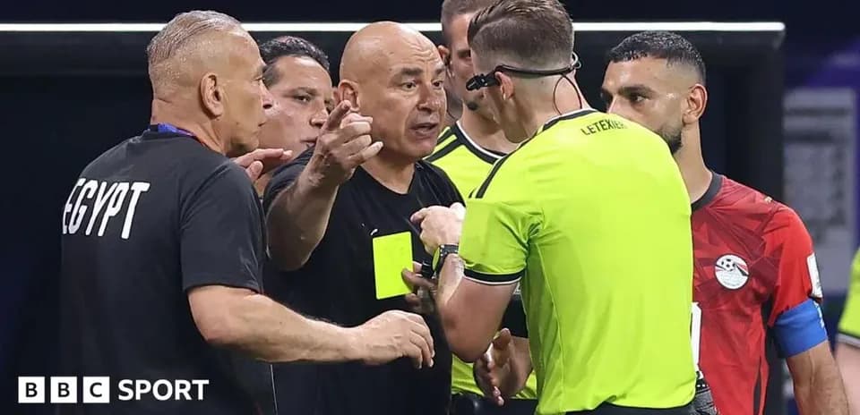 Coaches discussing with referee during match stoppage