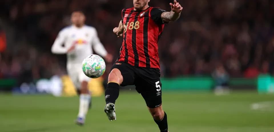 Bournemouth player kicking ball during match