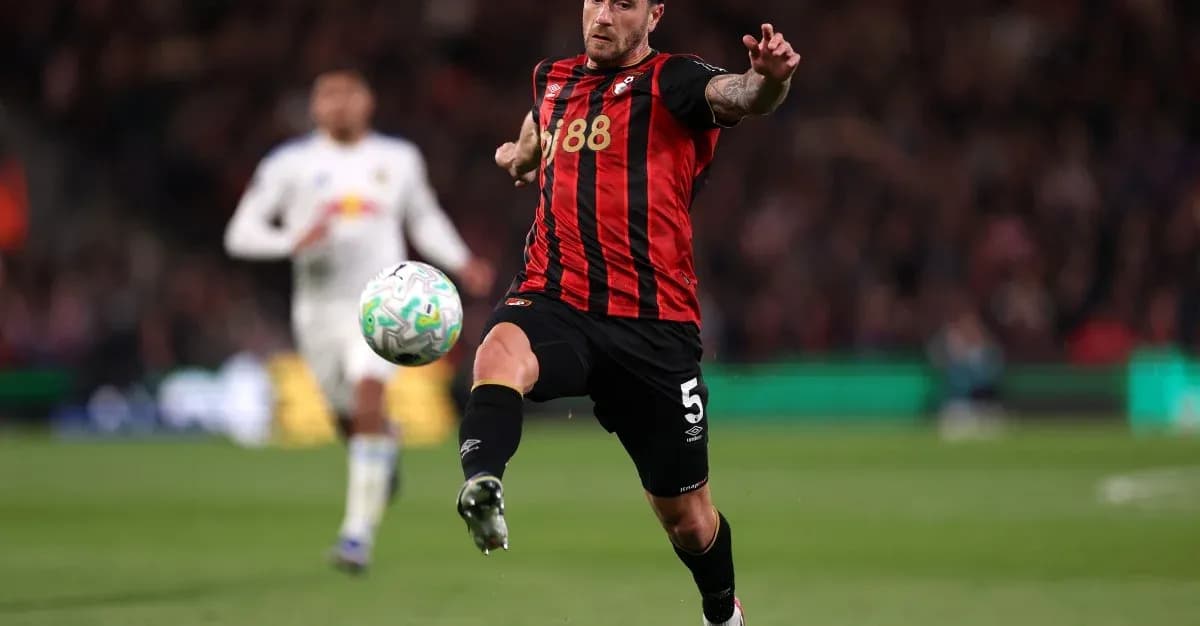 Bournemouth player kicking ball during match