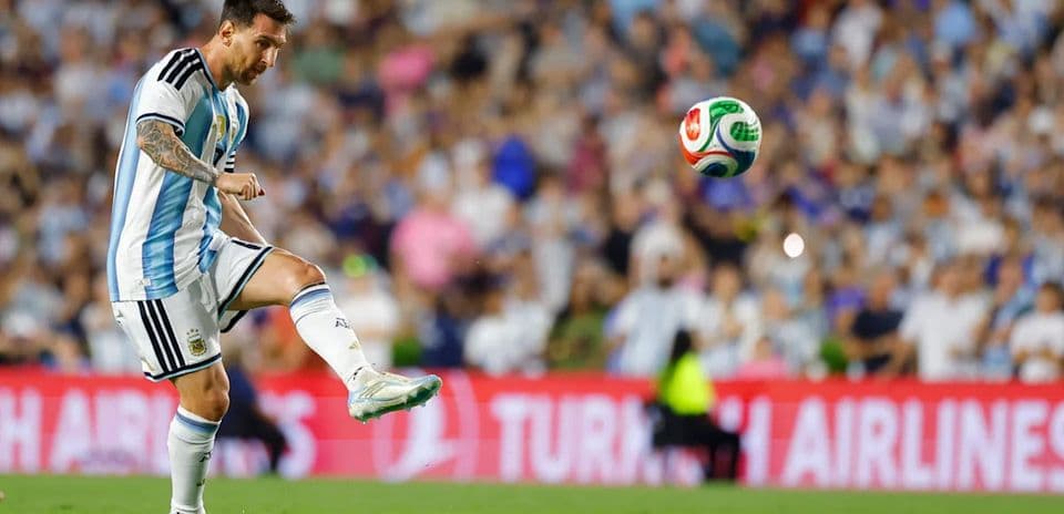 Lionel Messi striking the ball during a match