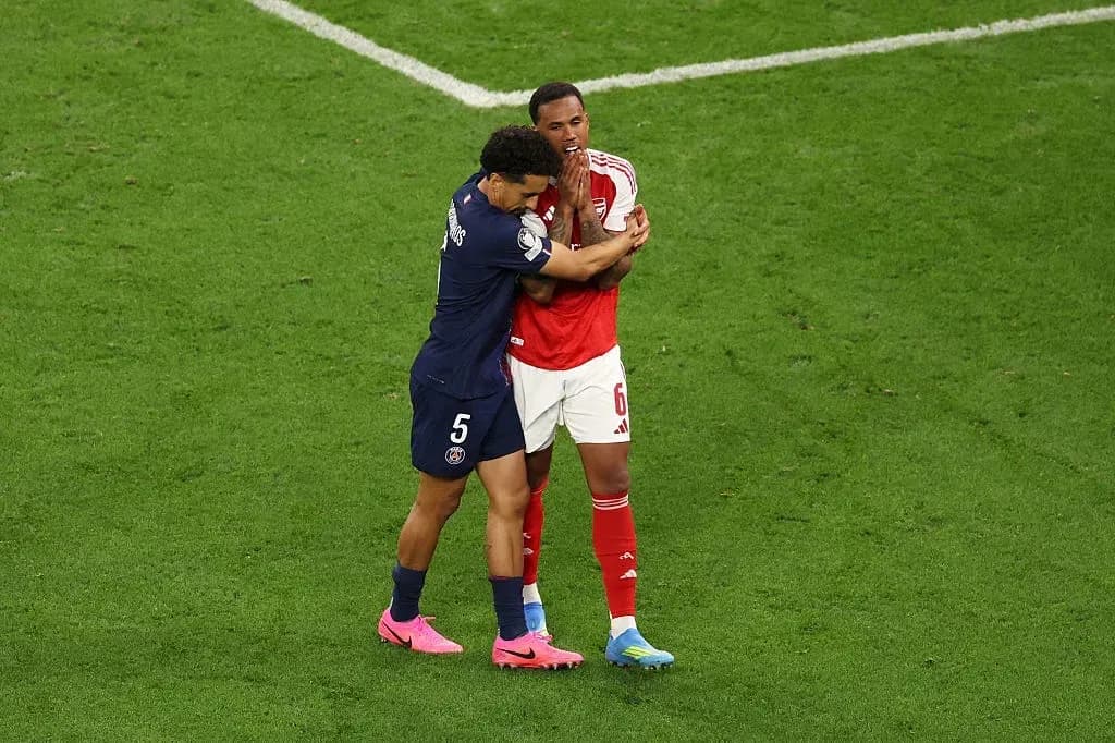 Two players embracing on the football field